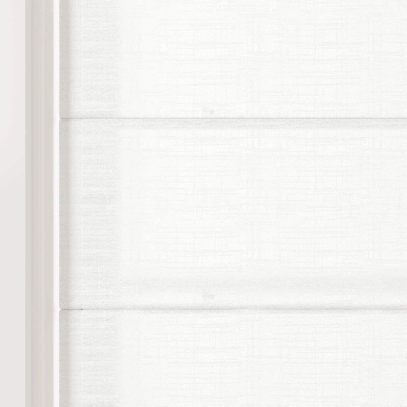 Digital photograph of a white Roman blind on an interior window featuring textured fabric with a subtle grid pattern soft horizontal folds and a crisp white frame on the left
