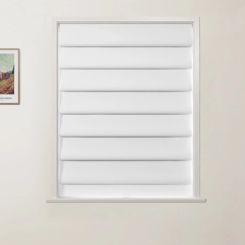 Photograph of an interior room featuring a window with white fabric pleated Roman blinds and a framed Van Gogh Arles landscape print on the subtle beige wall