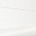 A crisp white textured fabric Roman blind displaying a subtle grid pattern and a clear plastic handle loop