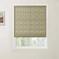 Photograph of an interior featuring a window dressed with a textured beige Roman blind displaying horizontal folds, beside a framed Van Gogh landscape print on a white wall