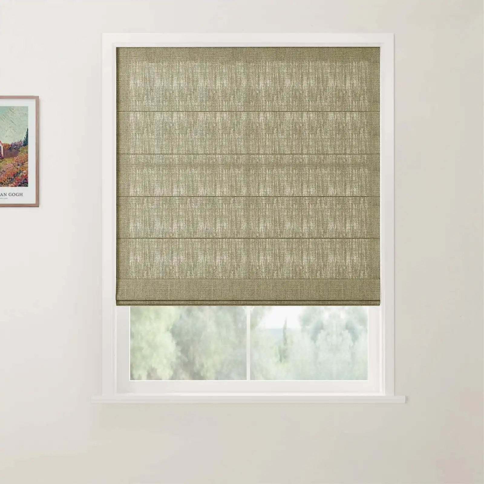 Photograph of an interior featuring a window dressed with a textured beige Roman blind displaying horizontal folds, beside a framed Van Gogh landscape print on a white wall