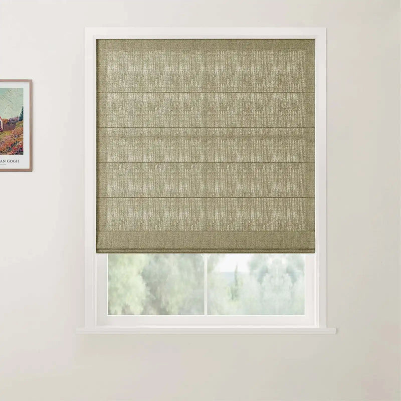 Photograph of an interior featuring a window dressed with a textured beige Roman blind displaying horizontal folds, beside a framed Van Gogh landscape print on a white wall