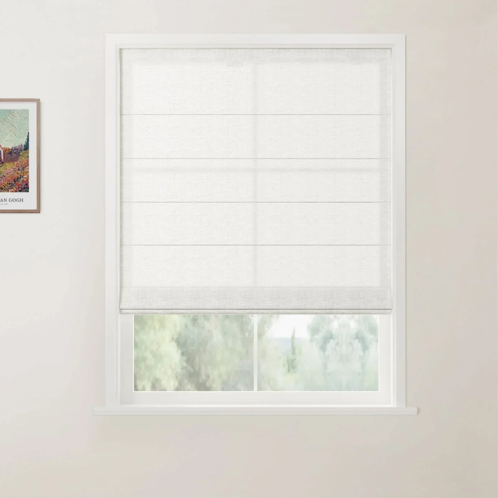 Interior photograph of a room with a window featuring a white linen-look roman blind, soft green trees visible outside, and a framed Van Gogh art print on the adjacent light wall