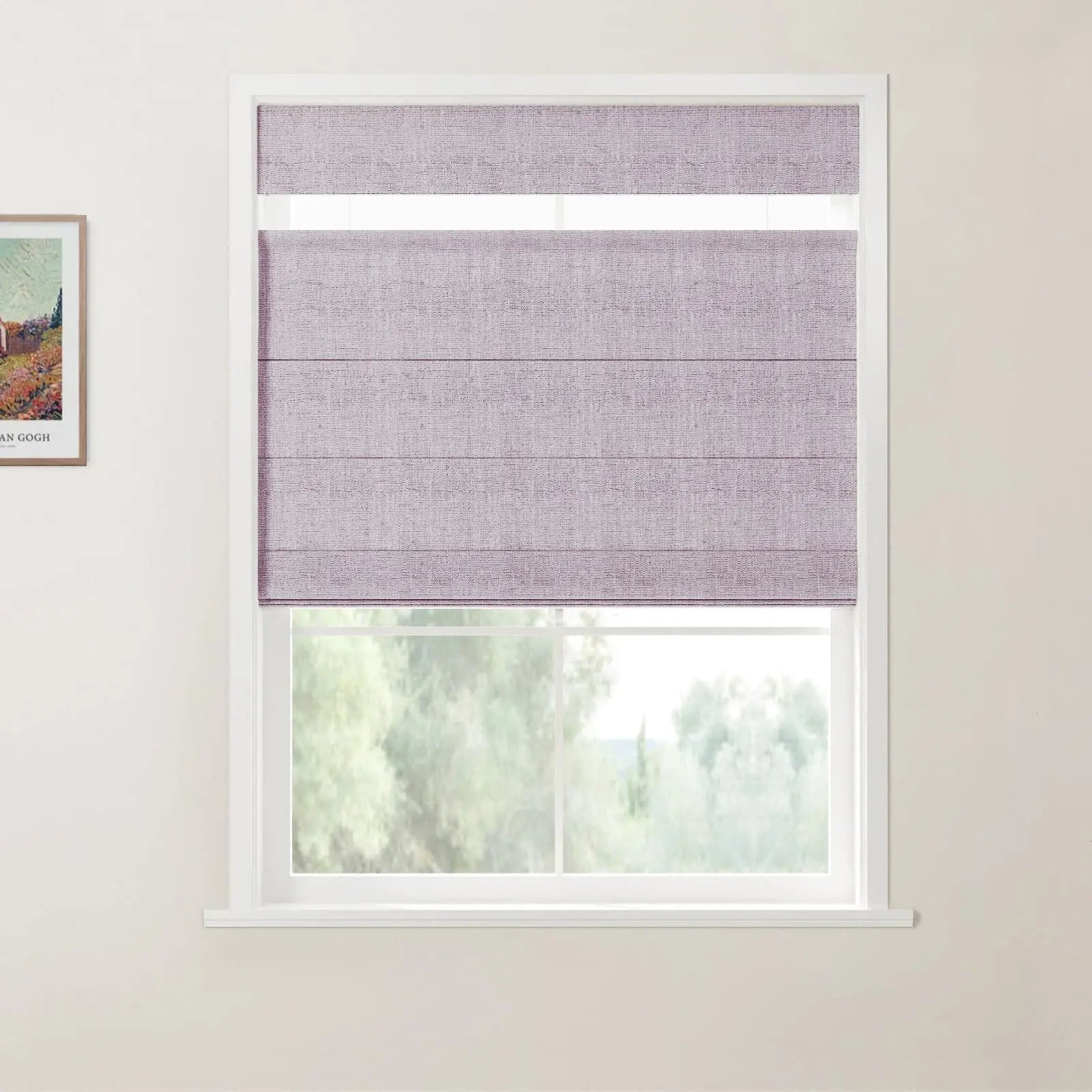 A framed Van Gogh colorful landscape painting with a house on a white wall next to a white-framed window showcasing light purple textured Roman blinds partially drawn over a blurred green outdoor vista