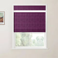 A modern photograph featuring a framed Van Gogh print on a white wall next to a window fitted with a deep purple textured top-down bottom-up roman blind, revealing a serene view of green foliage and distant hills outside