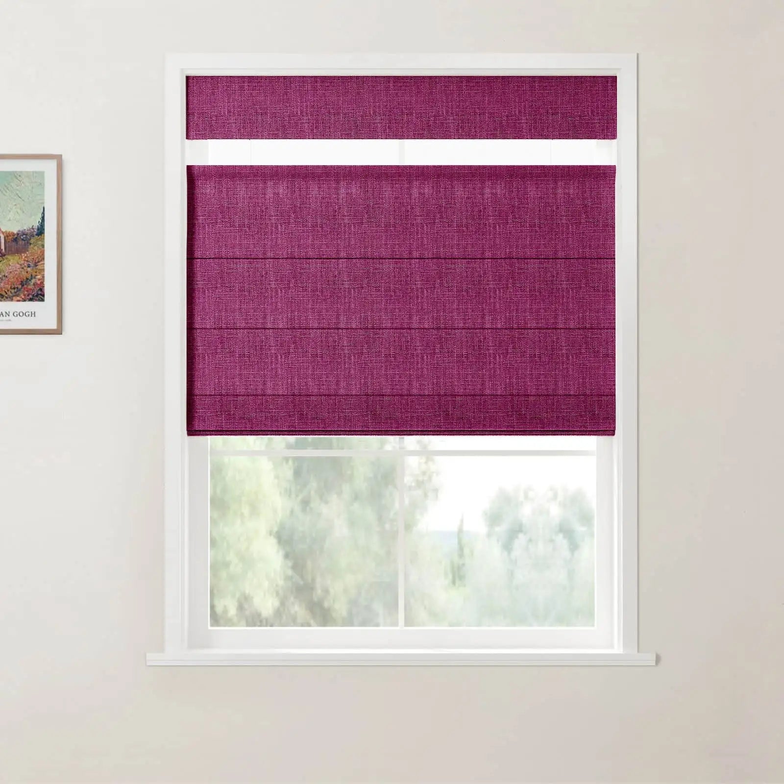 Photograph of a vibrant magenta textured Roman blind partially lowered in a white-framed window, with a framed Van Gogh landscape print visible on the left wall and blurred green foliage outside