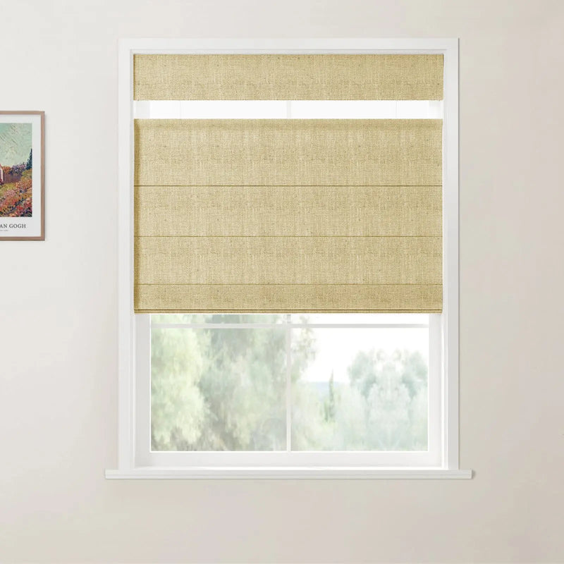 Photograph showing an interior window with a beige woven top-down bottom-up Roman blind, featuring a framed Vincent Van Gogh landscape print on the adjacent wall, and a blurred view of green trees outside