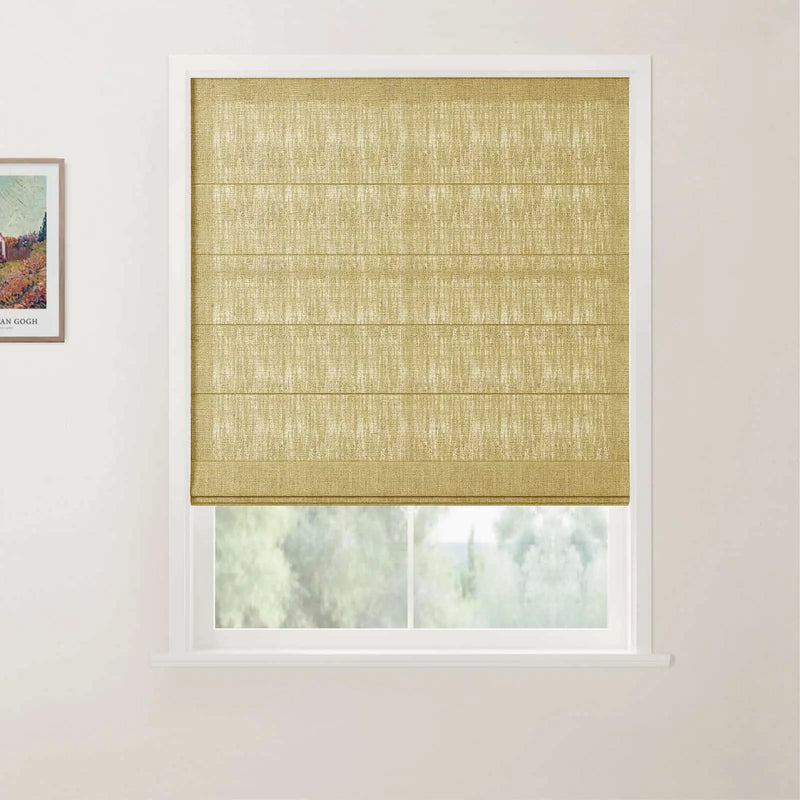 Photography showing a white-framed window with a textured chartreuse roman blind partially raised to reveal a blurred green landscape, with a framed Van Gogh print on the adjacent light wall