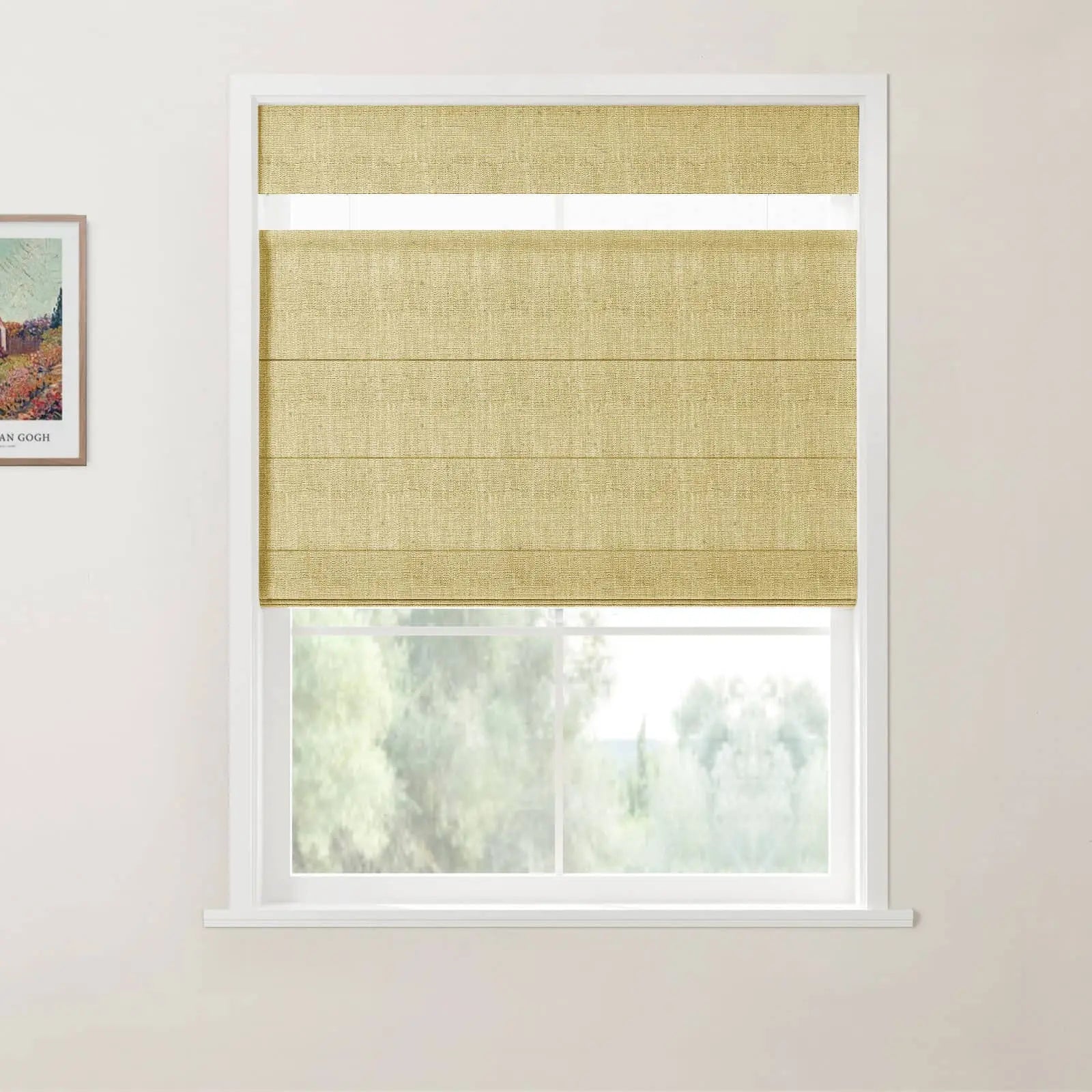 A digital photograph of a bright room featuring a window with a light tan textured linen Roman blind, its sheer top section pulled up to reveal a narrow clear glass strip, alongside a framed Van Gogh print on a white wall overlooking a soft green outdoor landscape