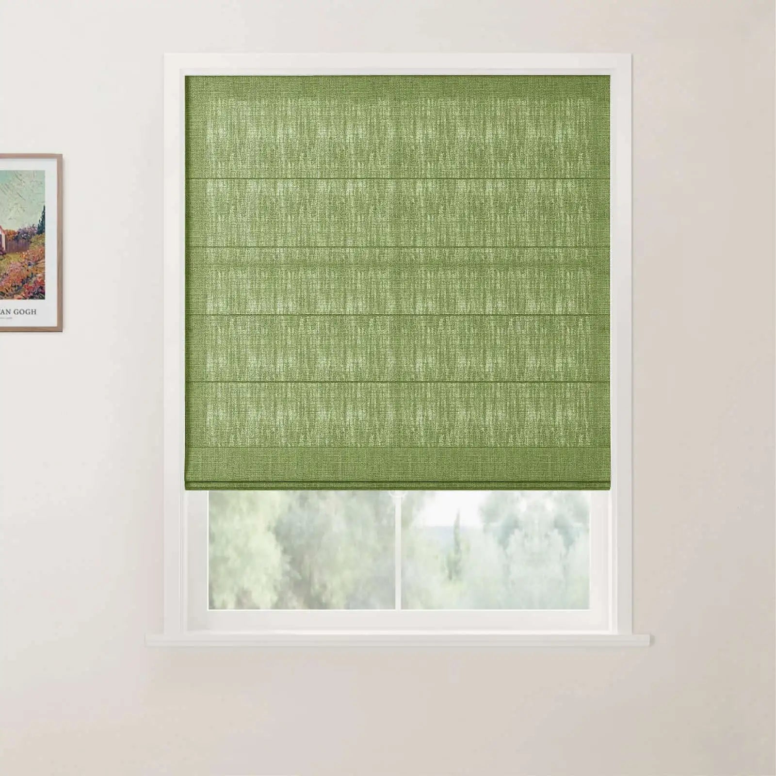 Photograph of a window in an indoor room, featuring a vibrant lime green textured Roman blind with horizontal pleats, an adjacent framed Vincent van Gogh landscape print, and a soft focus view of green trees outdoors