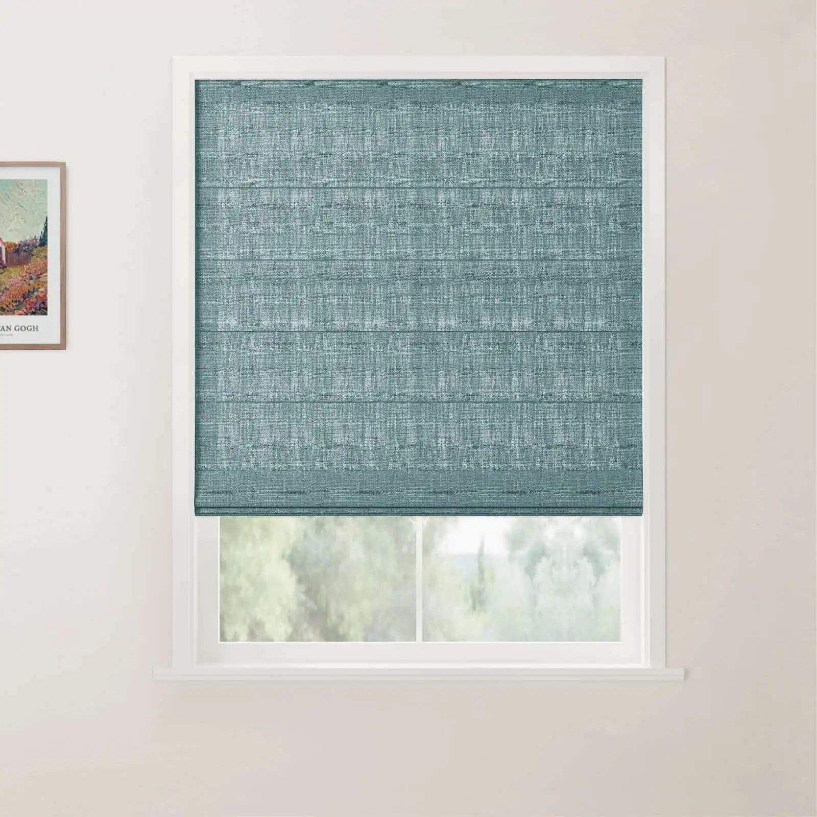 A modern interior window featuring a vibrant teal blue textured Roman blind partially open to reveal green foliage outside, with a framed Van Gogh landscape print visible on the adjacent white wall