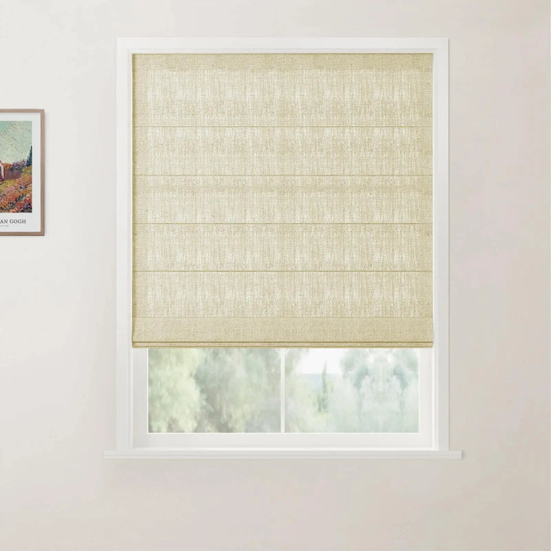 Photograph of an interior window featuring a light beige textured linen Roman blind, a white frame revealing blurred green trees outside, and a colorful framed Van Gogh print on the adjacent wall