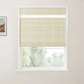 Photograph of an interior window with light beige linen Roman blinds featuring top-down functionality and white trim, accompanied by a partial Van Gogh art print on the adjacent wall, overlooking a blurred green landscape