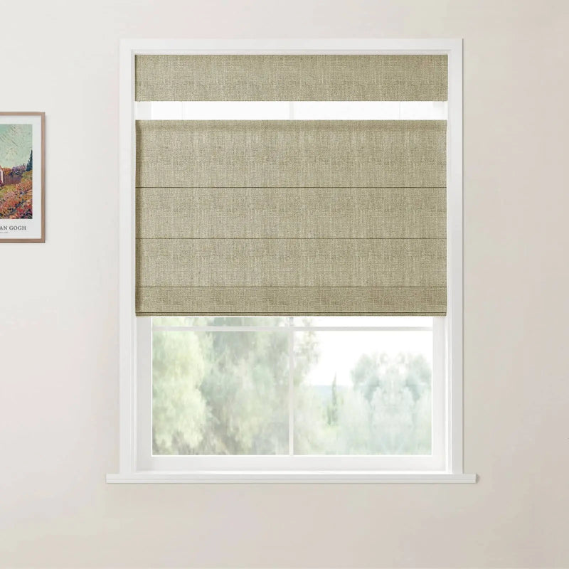 Photograph of a window in an interior room featuring a khaki-beige textured Roman blind pulled halfway down, a crisp white frame, and a partial framed Van Gogh print on the left wall overlooking a blurred green landscape