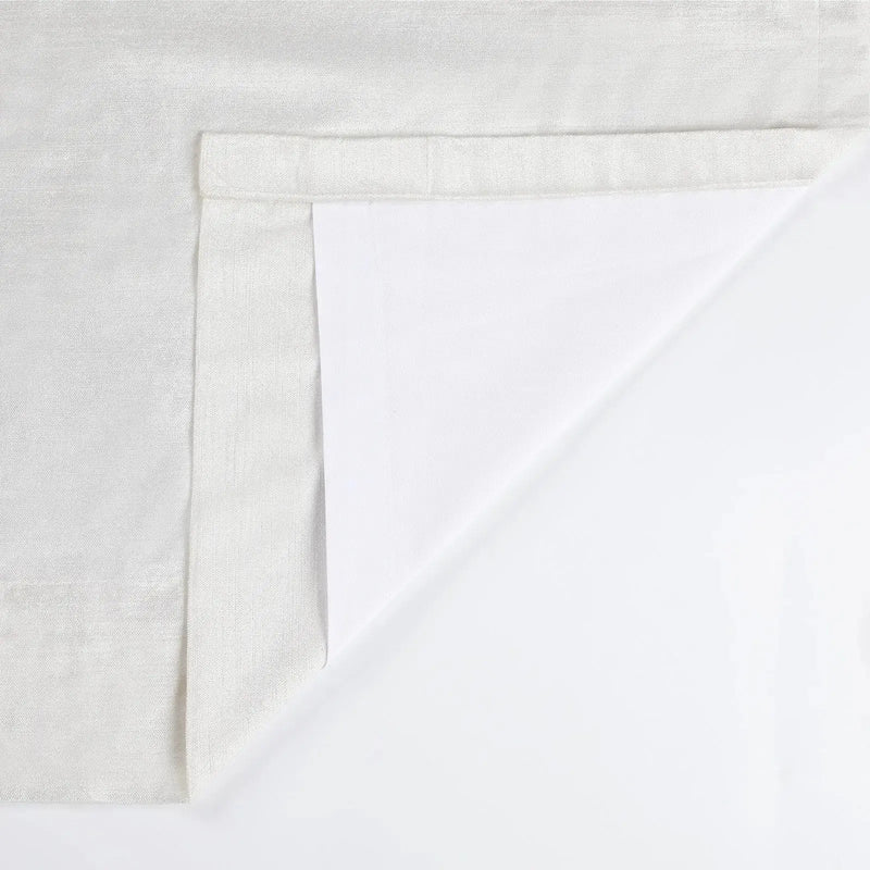 Textured light grey fabric with a white backing revealed by a corner fold and visible hem