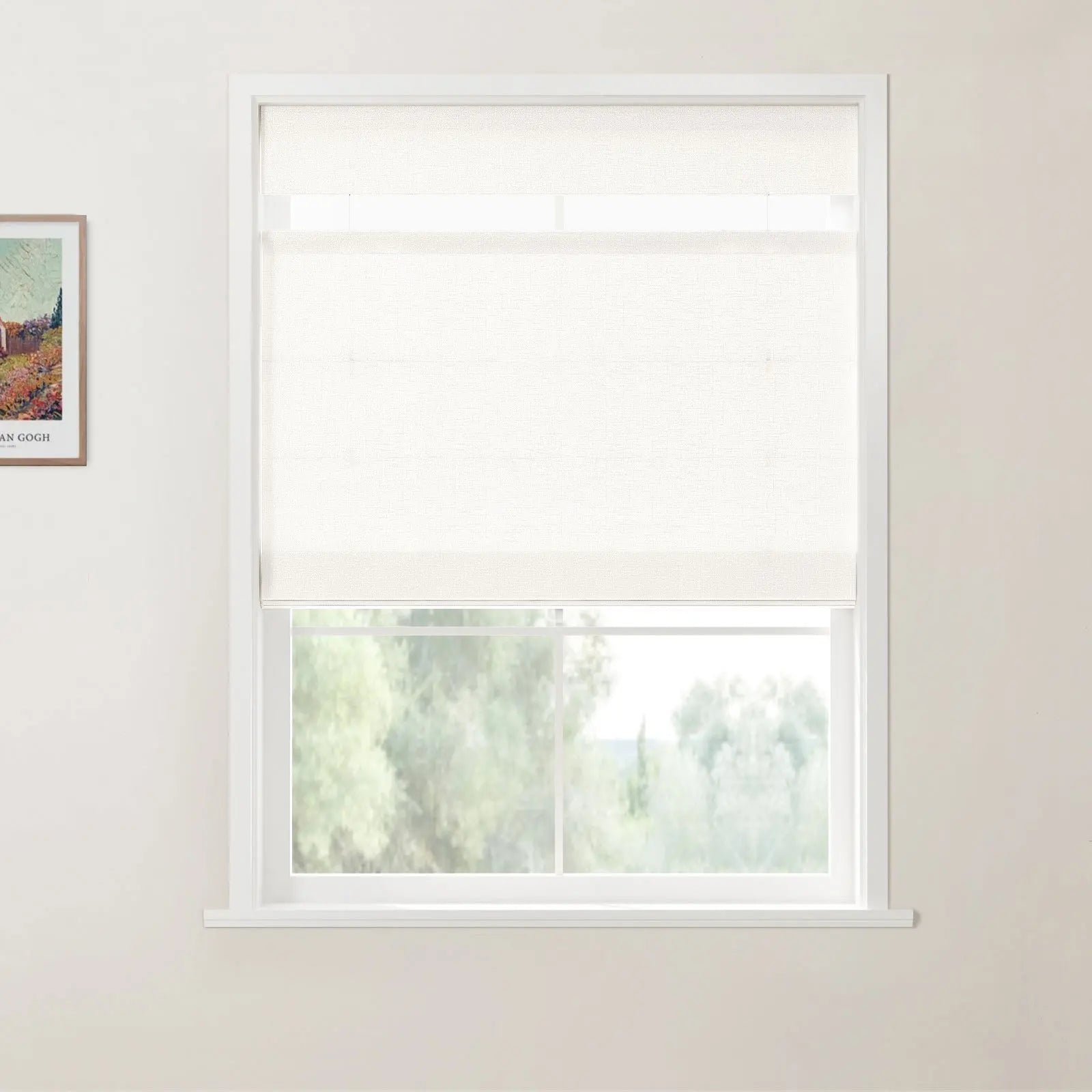 Photograph of a modern room interior featuring a white window frame with a partially lowered textured white roller shade, overlooking a lush green outdoor landscape, with a framed Van Gogh print of a vibrant field on the left wall