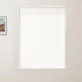 Photograph of white textured cellular blinds on a window within a light beige room featuring a framed Van Gogh colorful landscape print on the left wall