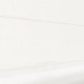 Photograph of a light ivory textured roller blind featuring a subtle horizontal weave and a clear D-shaped plastic pull handle