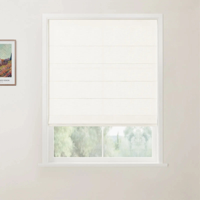 A framed Van Gogh print on a white wall adjacent to a window with a partially drawn white textured Roman blind revealing a blurred green outdoor landscape