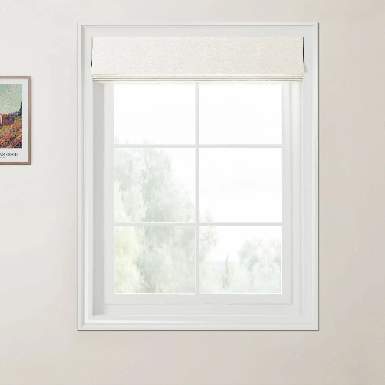 Photograph of a white-framed window featuring a light beige textured Roman blind at the top, a subtle Van Gogh print on the adjacent wall, and a blurry natural landscape of green trees beyond the glass