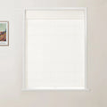 A framed Van Gogh print of a vibrant landscape hangs on a light wall next to a window featuring a clean white frame and an off-white textured cellular blind with a small pull tab