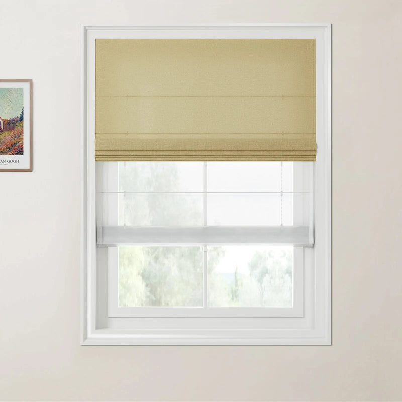 Photograph of a modern interior featuring a window dressed with a textured tan Roman blind and a white sheer blind, with a framed Van Gogh landscape print displaying colorful flowers on the adjacent light beige wall