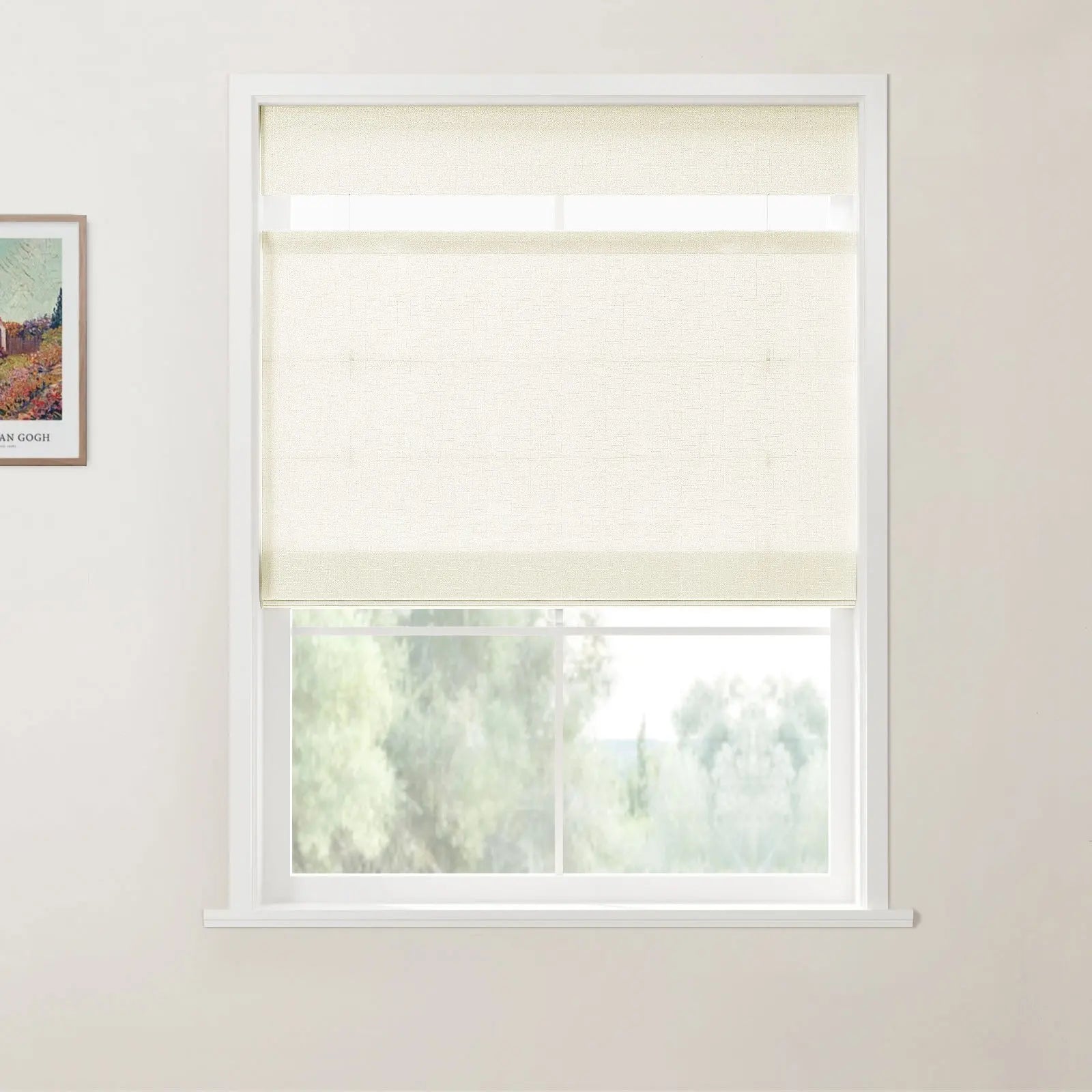 Interior photo of a white-framed window with a cream textured roller blind partially lowered, revealing blurred green trees outside, and a framed Van Gogh landscape print on the adjacent white wall
