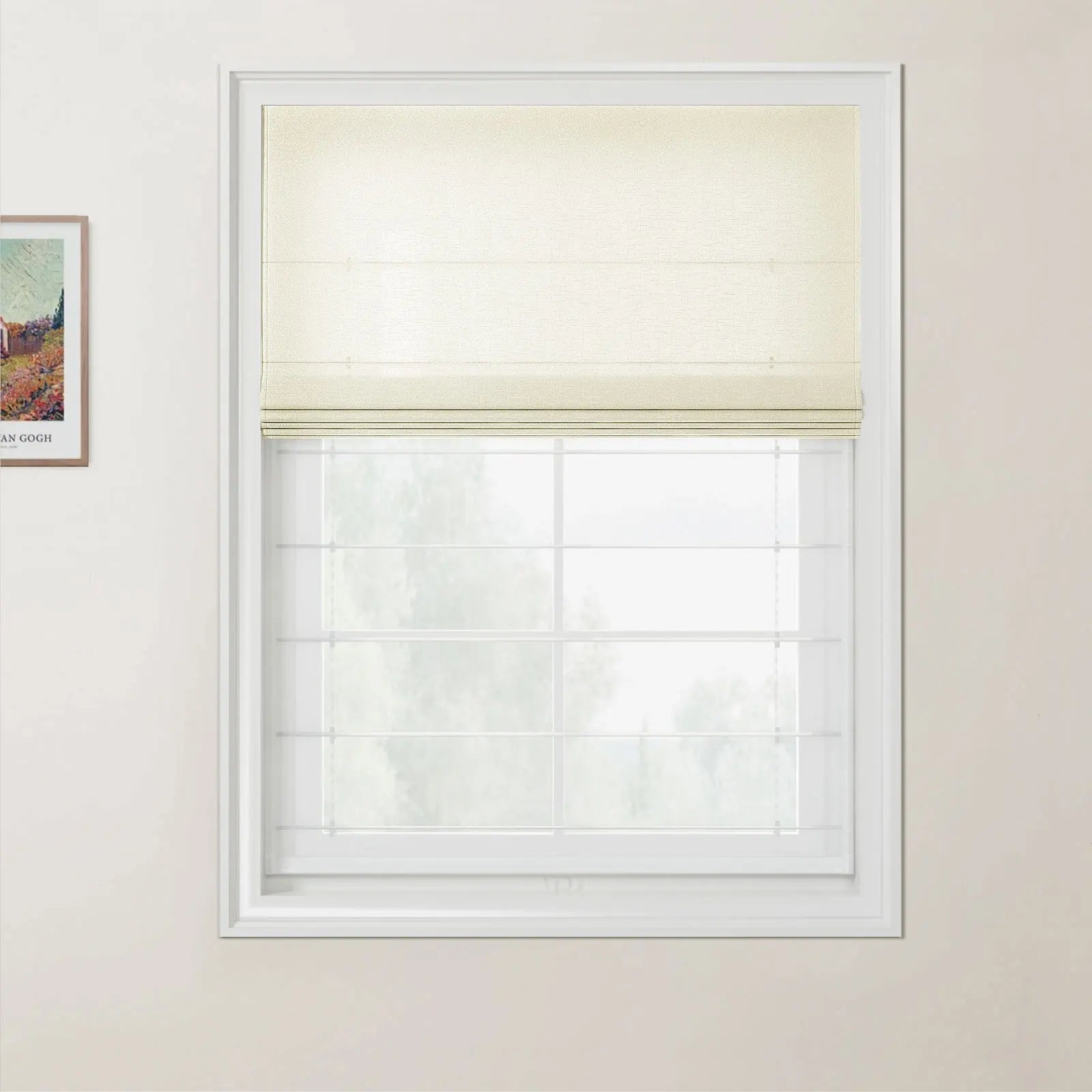 A photograph showing an interior window fitted with a partially lowered cream textured Roman blind, white grid windowpanes, light beige walls, and a visible framed Van Gogh print on the adjacent wall