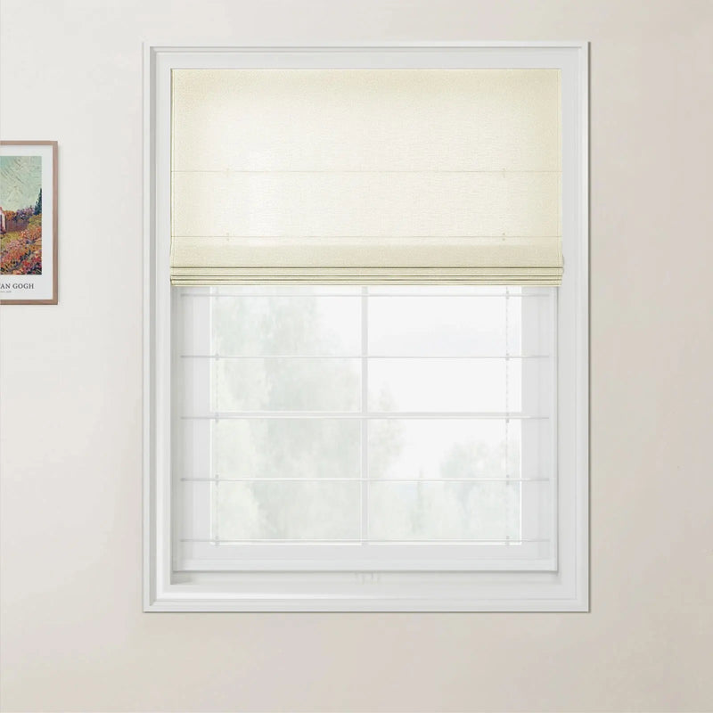 A photograph showing an interior window fitted with a partially lowered cream textured Roman blind, white grid windowpanes, light beige walls, and a visible framed Van Gogh print on the adjacent wall