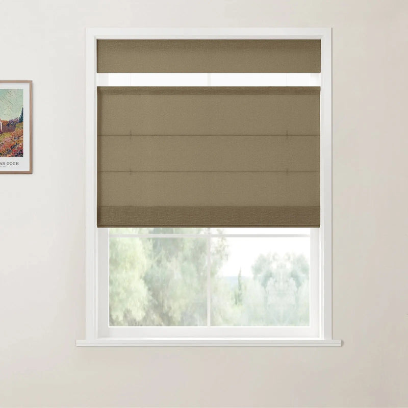 A window featuring a brown fabric roller blind partially down, set in a white frame, with a blurred natural green landscape visible outside and a framed print of Van Gogh's *Vineyards with a View of Auvers* on the left wall