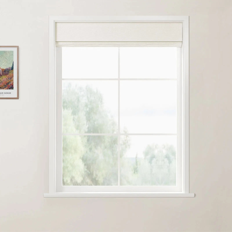 A framed print of Vincent van Gogh's *A Wheatfield with Cypresses* hangs next to a white gridded window with a raised textured beige Roman blind overlooking blurred green trees