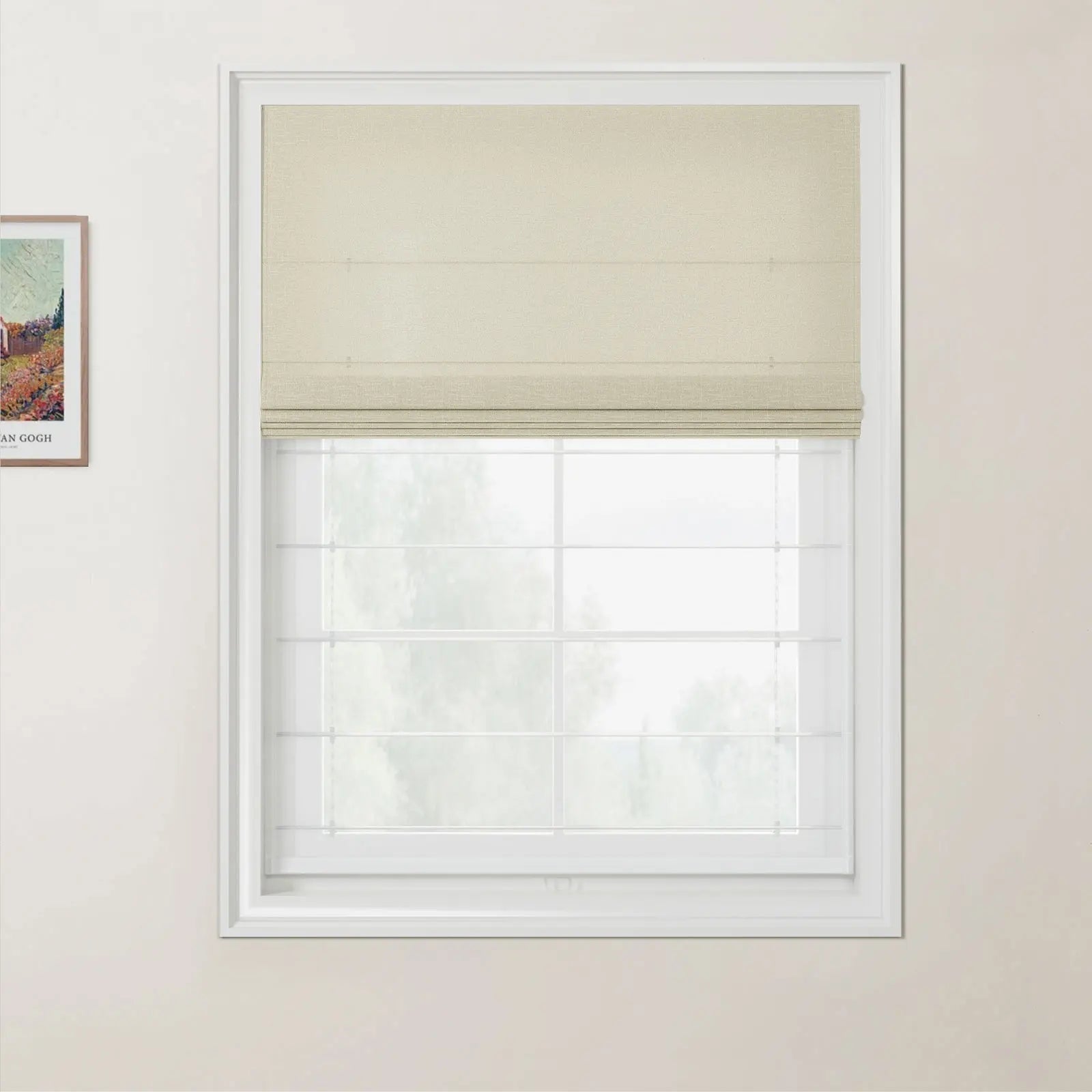Photograph of a partially lowered beige textured Roman blind covering a white multi-pane window in a cream room, with a framed Van Gogh landscape print on the left wall