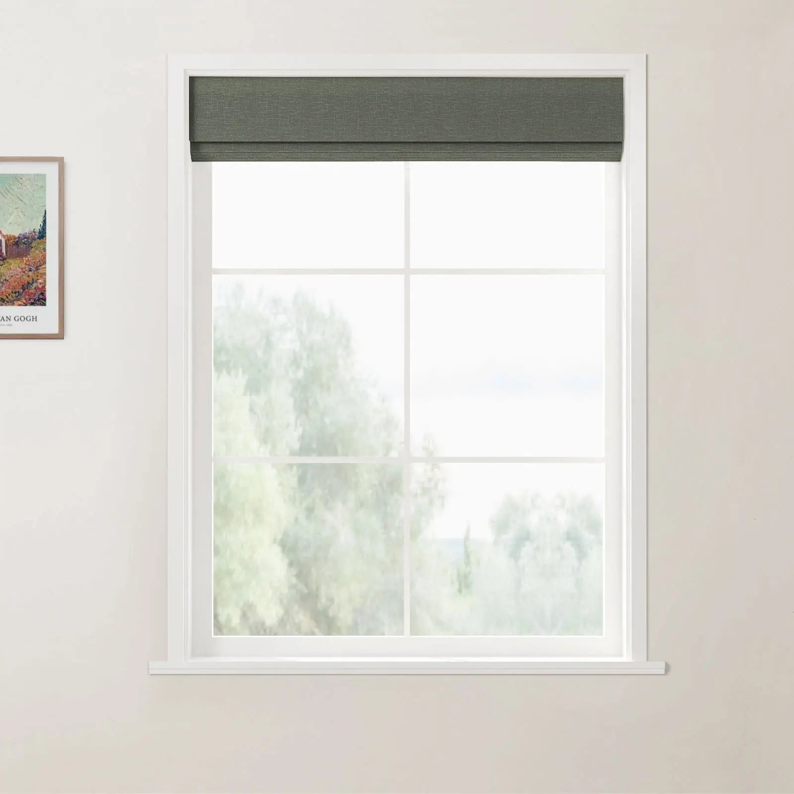 A photograph of a white multi-pane window with a dark green roman blind and a soft view of blurry green trees, situated next to a framed Van Gogh print prominently labeled 'VAN GOGH' on a cream wall