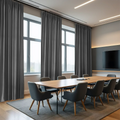A modern conference room interior with floor-to-ceiling charcoal grey curtains, a long light oak conference table surrounded by dark grey upholstered chairs, and a wall-mounted TV with subtle warm cove lighting