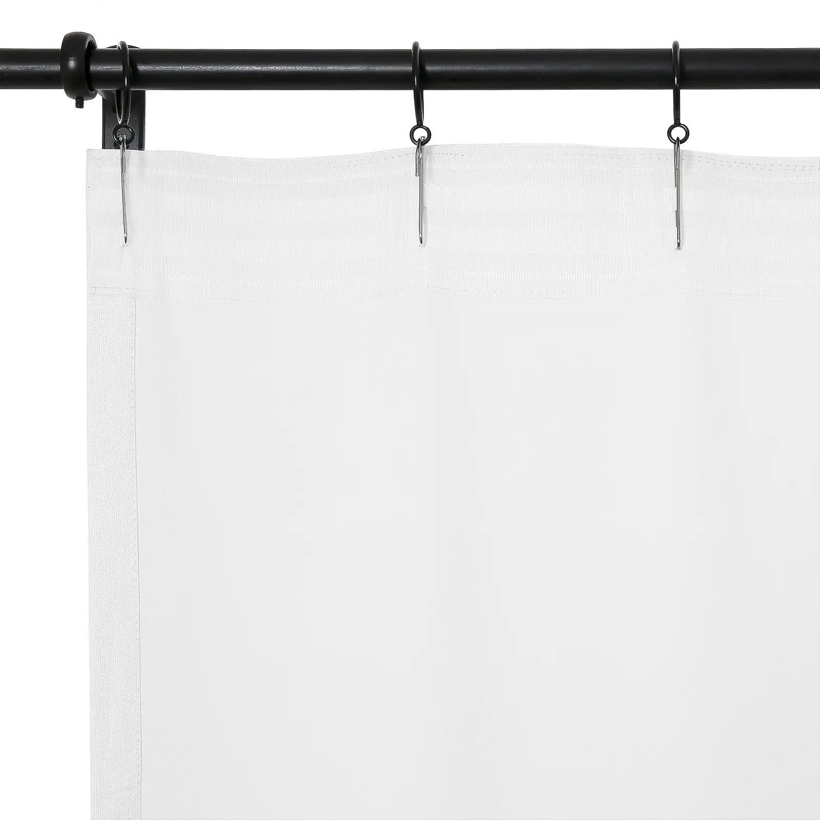 A white curtain panel hangs from a black curtain rod with silver clip rings, showcasing the subtle textured hem of the fabric