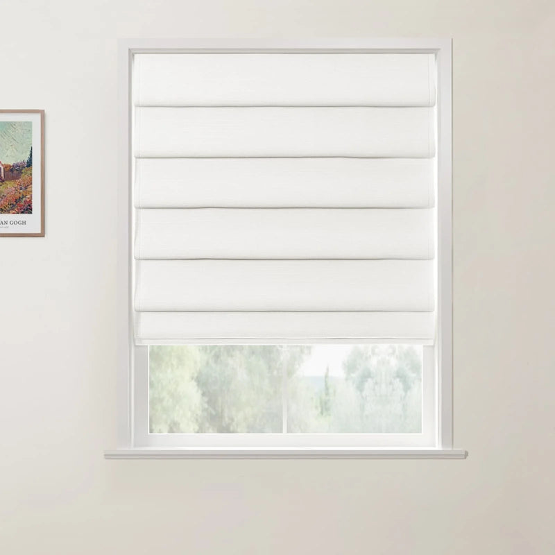 Photograph featuring a crisp white textured Roman blind partially lowered on a window, revealing a serene view of green trees and a distant landscape, alongside a framed print of Van Gogh's vibrant The Red Vineyards at Arles on the wall