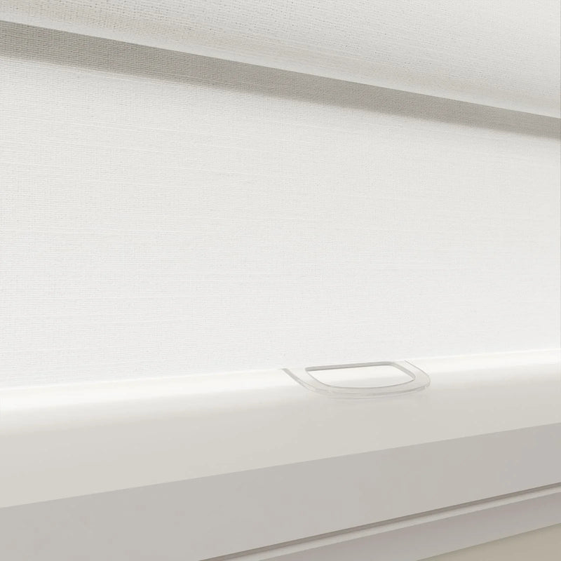 Modern white textured day-night roller blind featuring a clear plastic finger pull handle and white bottom rail