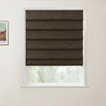 A dark brown textured Roman blind within a white window frame showcasing a blurred green outdoor landscape and a framed Van Gogh print on the adjacent white wall