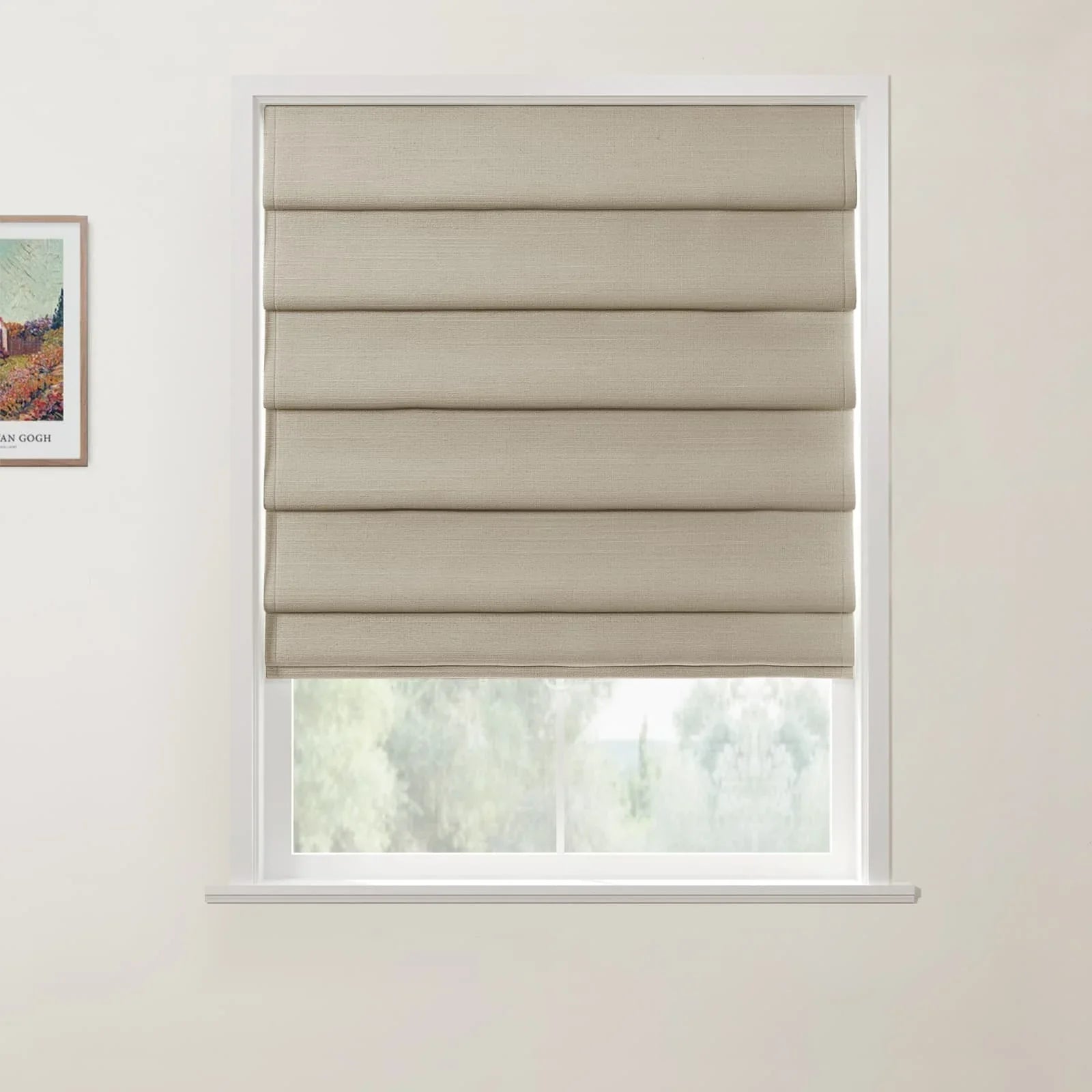 Interior scene showing a window with a beige textured Roman blind and white trim, offering a blurry view of green trees outside, complemented by a framed Van Gogh landscape print on the left wall