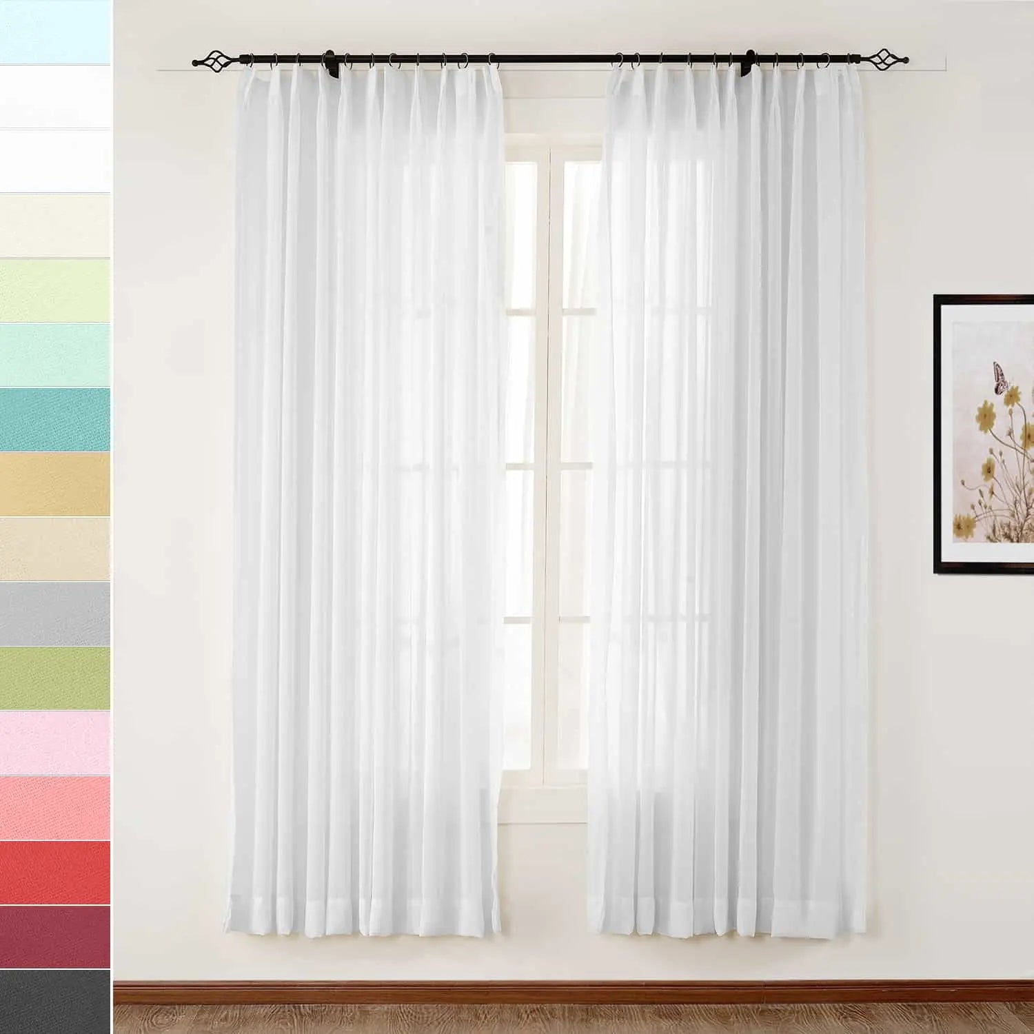 White sheer window curtains hanging from a black decorative rod with scrolled finials, with a framed print of yellow flowers and a butterfly on the right, and a vertical palette of color swatches on the left