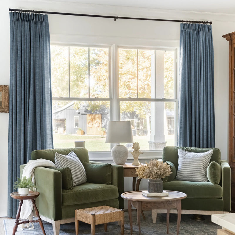 Aegean Blue Liz linen curtains framing a bright window in a balanced full-length interior view