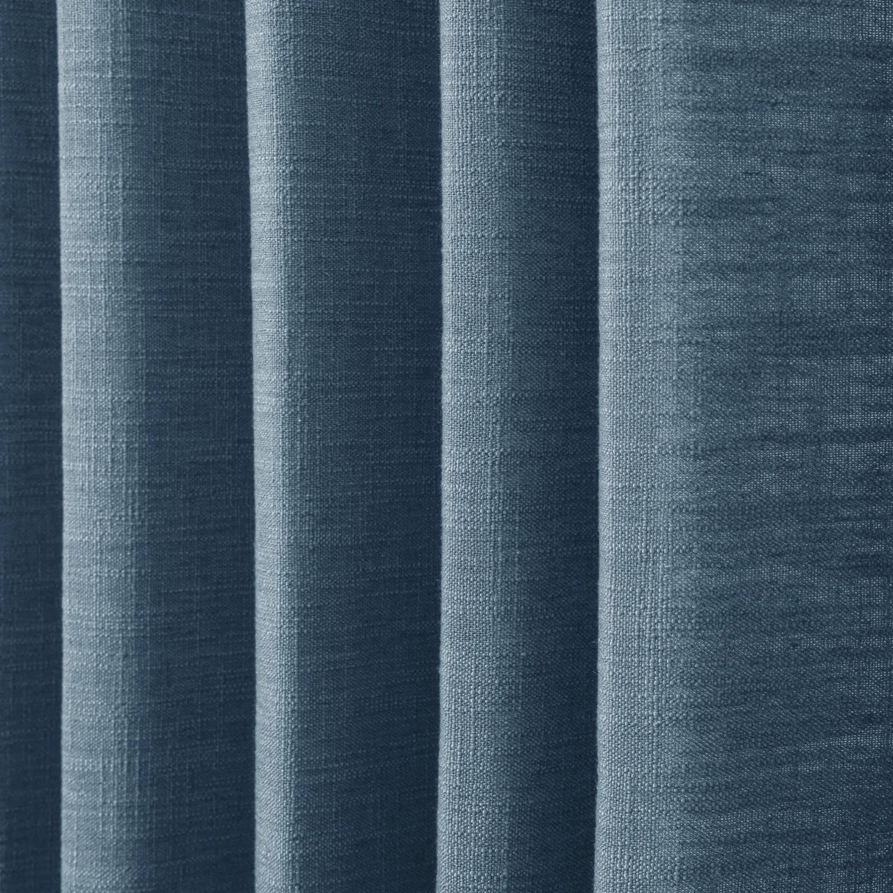 Aegean Blue Liz linen curtains in a close room detail highlighting the linen texture and colour