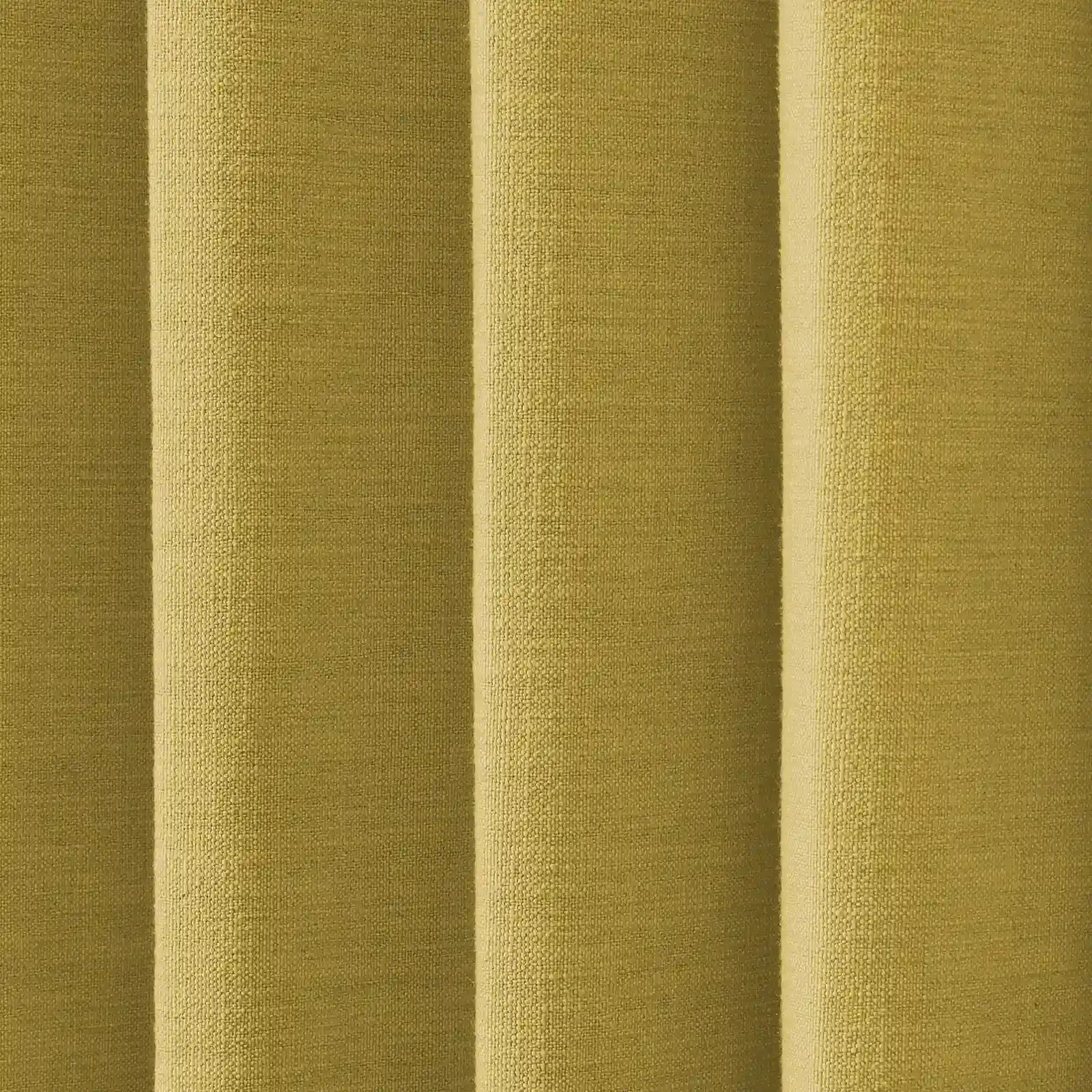 Photograph of an olive green fabric with a coarse woven texture and deep vertical pleats showing light and shadow play