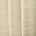 Photograph of a cream-colored linen curtain with a loose weave and soft vertical folds