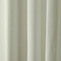 Photograph of a creamy off-white textured fabric curtain featuring soft vertical folds and subtle light and shadow interplay
