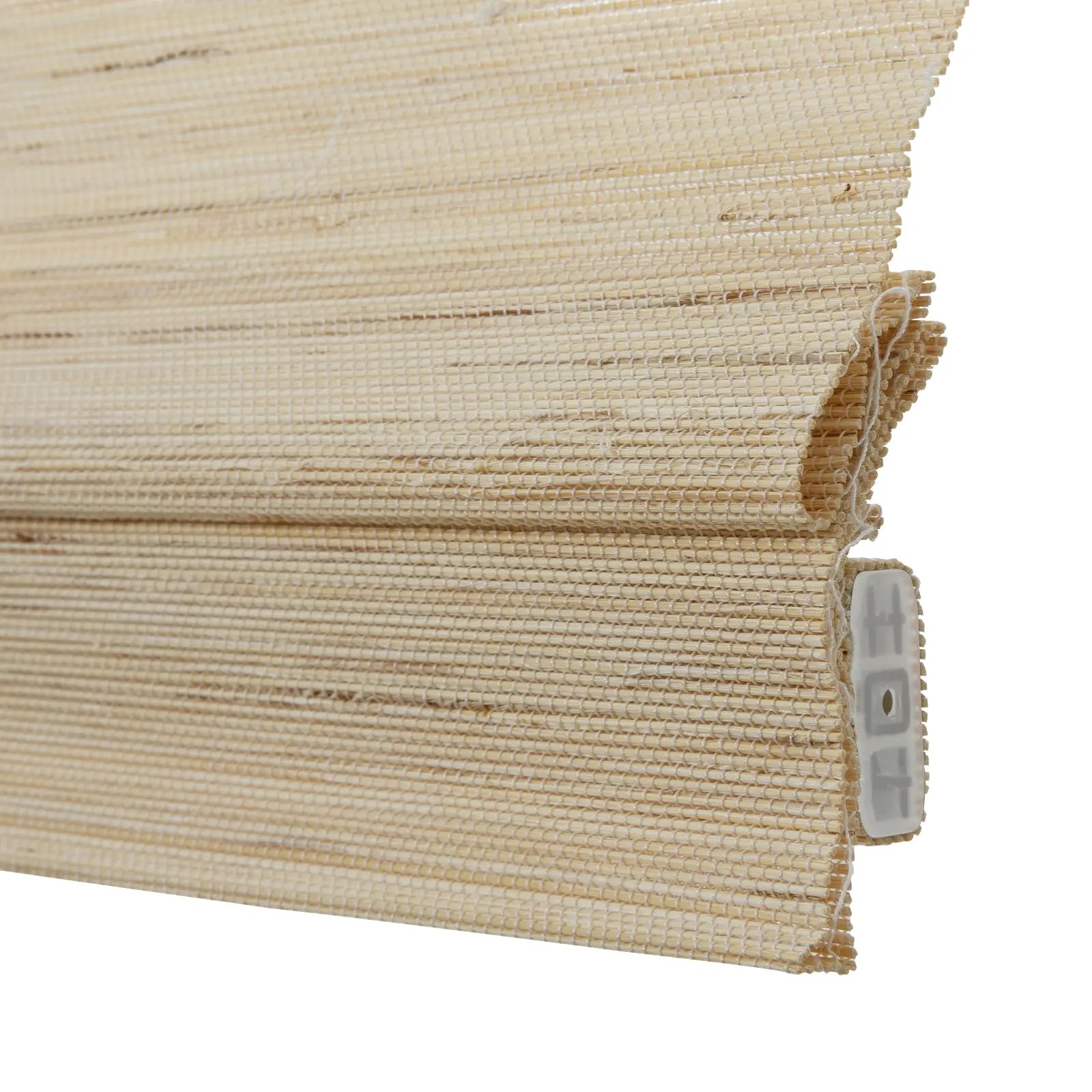Photograph of a light beige woven bamboo roller blind with horizontal texture showing folded layers and a white plastic mounting mechanism on the right