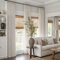 Beige White Liz Linen Pleated Curtains in a neutral living room with corner windows and a white sofa