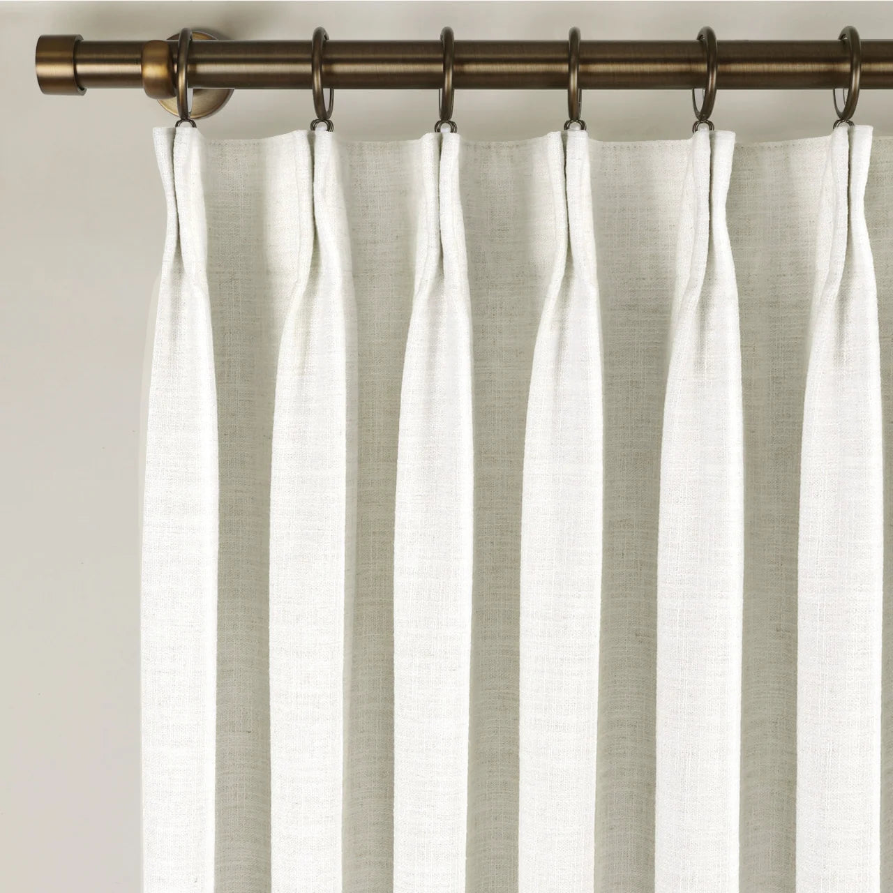 Beige White Liz Linen Pleated Curtains triple pinch pleat heading on a bronze curtain rod