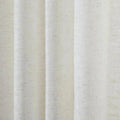Textile photograph of off-white pleated fabric with a visible natural linen-like weave and subtle dark flecks