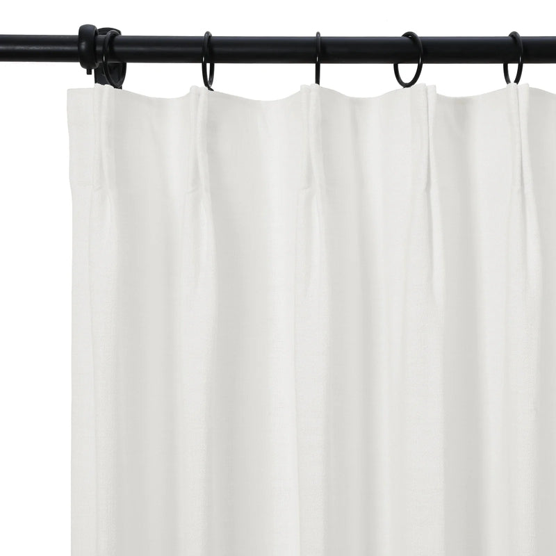 Product photography showing a pristine white sheer curtain with visible subtle texture neatly pleated and suspended from a contrasting matte black metal rod using black rings
